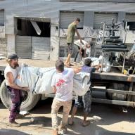 Five MEDSF staff load tents on to a truck in Gaza City